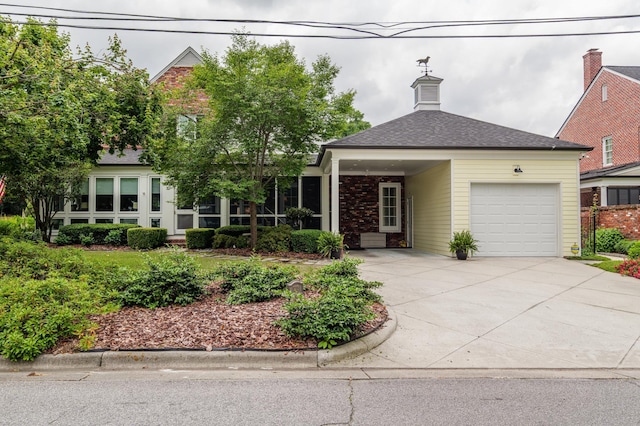 1201 Reid Rd, Augusta, GA 30909 - view of front of home with concrete driveway, a garage, and roof with shingles