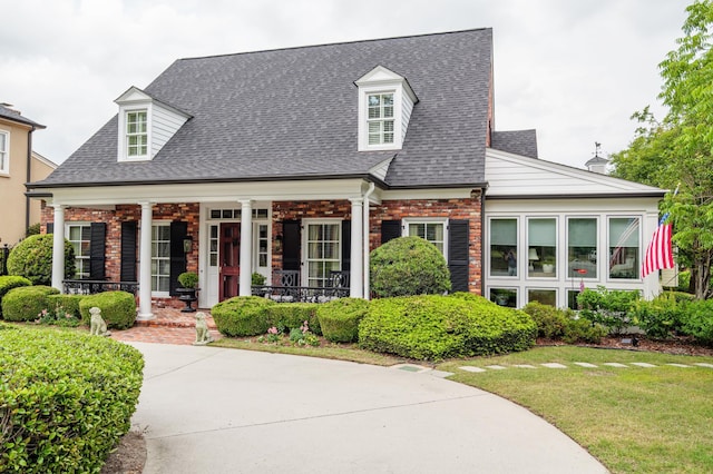 1201 Reid Rd, Augusta, GA 30909 - cape cod house with roof with shingles, a porch, brick siding, and a front yard