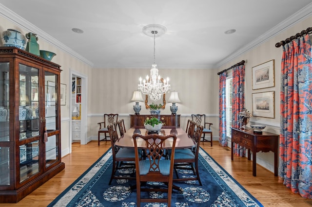 1201 Reid Rd, Augusta, GA 30909 - dining room with ornamental molding, an inviting chandelier, and wood finished floors