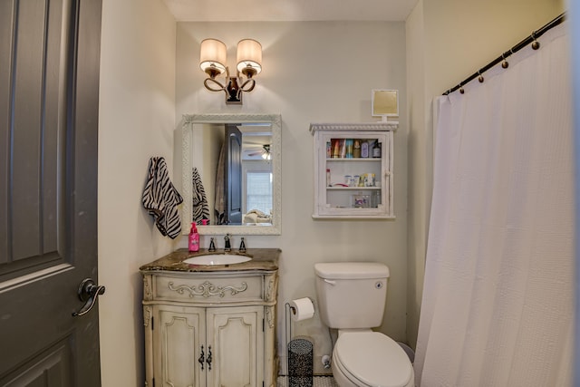 bathroom with ceiling fan, vanity, and toilet