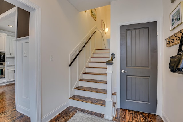 foyer entrance with dark wood-type flooring