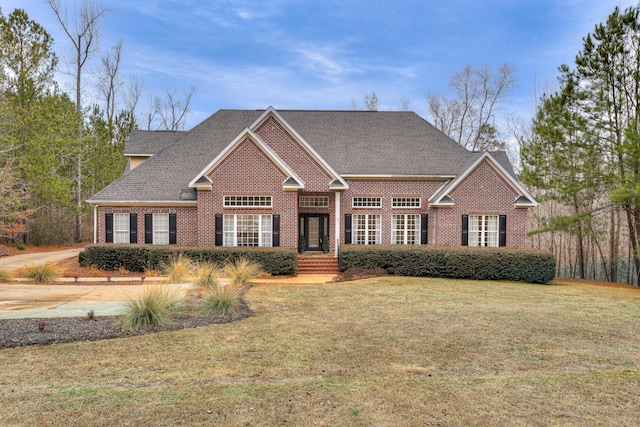 craftsman-style house with a front yard