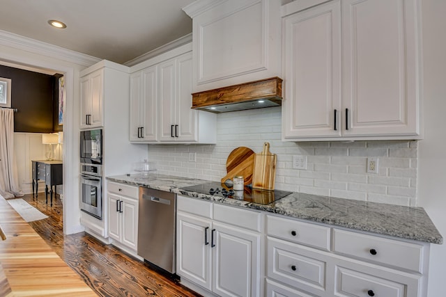 kitchen with light stone countertops, tasteful backsplash, dark wood-type flooring, black appliances, and white cabinetry