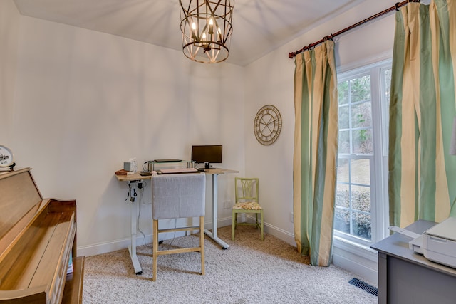 office area with light colored carpet and a chandelier