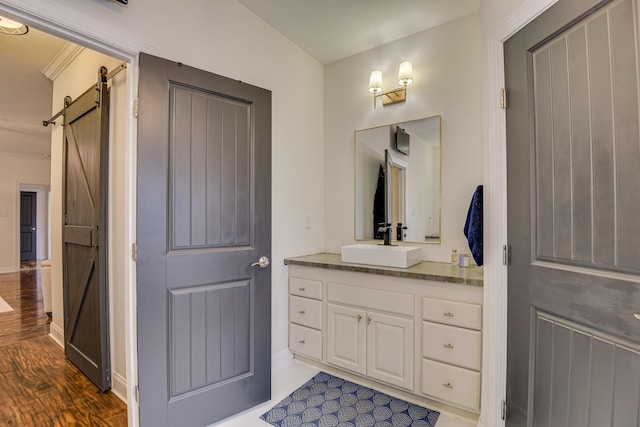 bathroom with vanity and hardwood / wood-style flooring