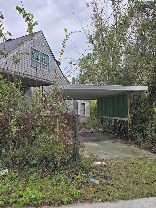 exterior space featuring a carport