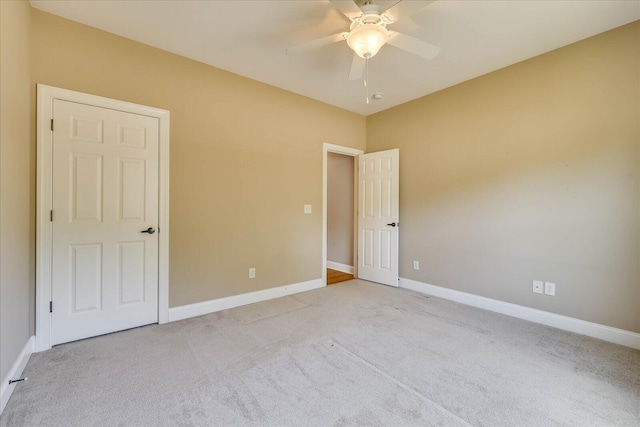 113 Rutledge Ln, Mccormick, SC 29835 - unfurnished bedroom featuring baseboards, a ceiling fan, and light colored carpet