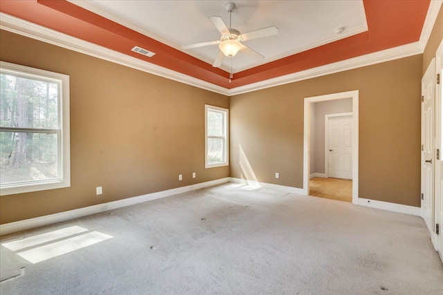 113 Rutledge Ln, Mccormick, SC 29835 - carpeted spare room featuring a ceiling fan, visible vents, baseboards, a raised ceiling, and ornamental molding