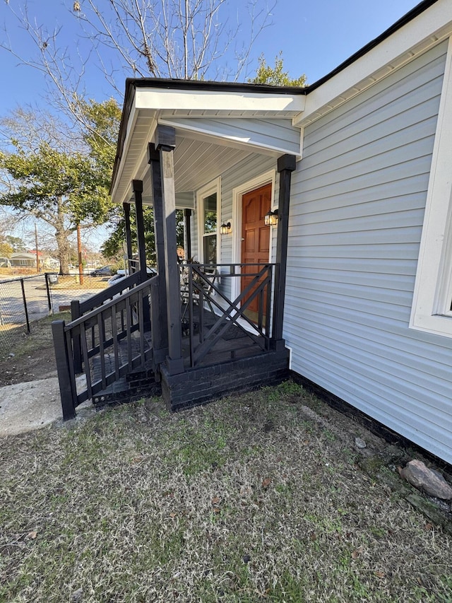 doorway to property with a porch