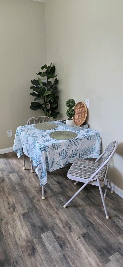 dining area with wood-type flooring