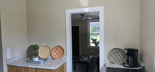 interior space featuring ceiling fan