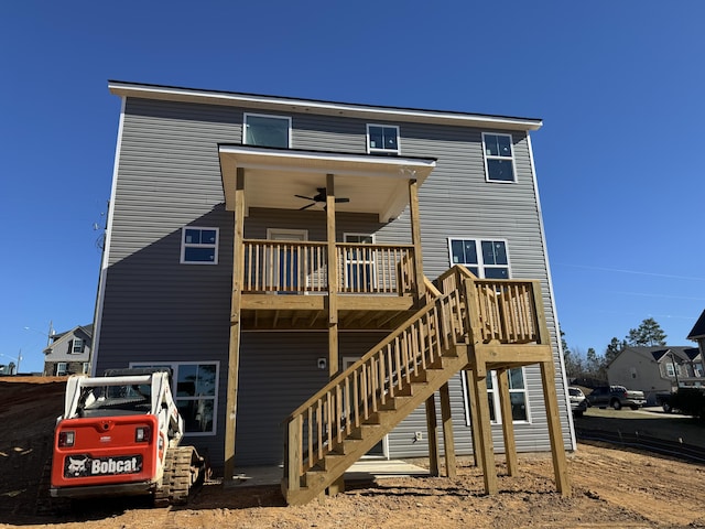 rear view of property with ceiling fan