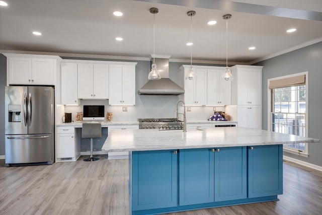 305 Kingfisher Pt, Mccormick, SC 29835 - kitchen featuring stainless steel refrigerator with ice dispenser, blue cabinetry, wall chimney range hood, and decorative light fixtures