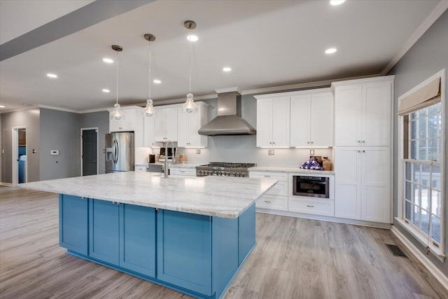 305 Kingfisher Pt, Mccormick, SC 29835 - kitchen featuring wall chimney exhaust hood, white cabinetry, hanging light fixtures, a large island with sink, and stainless steel appliances