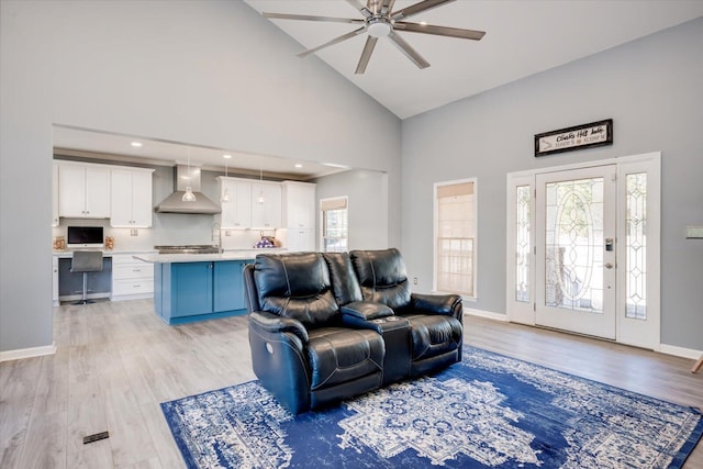 305 Kingfisher Pt, Mccormick, SC 29835 - living room with ceiling fan, a healthy amount of sunlight, high vaulted ceiling, and light hardwood / wood-style flooring