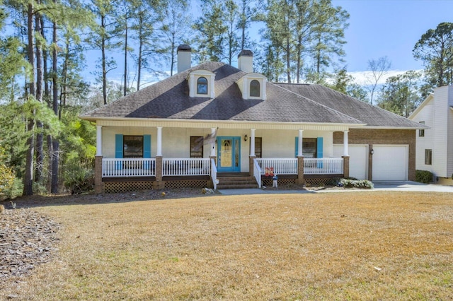 305 Kingfisher Pt, Mccormick, SC 29835 - view of front of property featuring a garage, a front lawn, and a porch