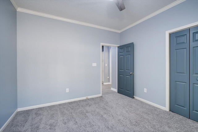305 Kingfisher Pt, Mccormick, SC 29835 - unfurnished bedroom featuring ornamental molding, light carpet, ceiling fan, and a closet