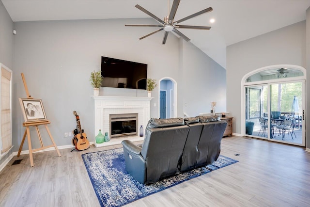 305 Kingfisher Pt, Mccormick, SC 29835 - living room with a brick fireplace, high vaulted ceiling, ceiling fan, and light wood-type flooring