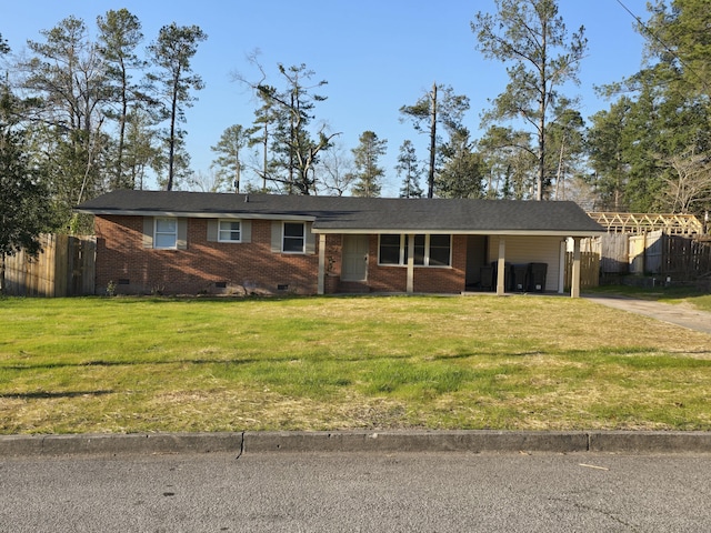 ranch-style home with a front yard, crawl space, brick siding, and fence