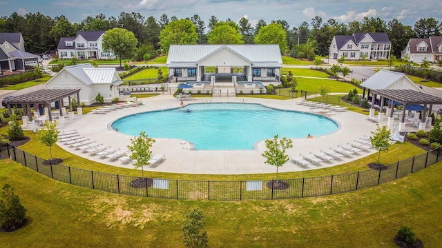 view of swimming pool with a patio, a lawn, and a pergola