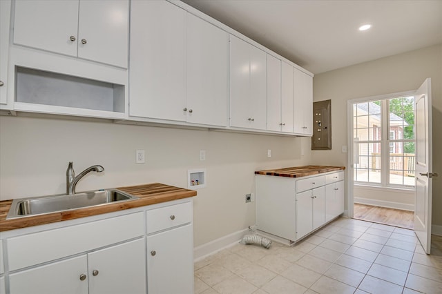 1 Bohler Ave, Evans, GA 30809 - laundry room with hookup for a washing machine, hookup for an electric dryer, electric panel, light tile patterned floors, and cabinet space