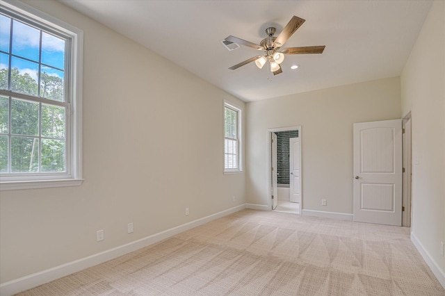 1 Bohler Ave, Evans, GA 30809 - unfurnished bedroom featuring light colored carpet, connected bathroom, and a ceiling fan