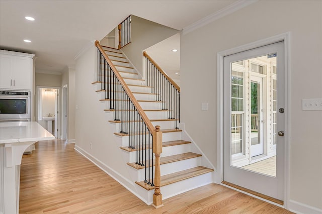 1 Bohler Ave, Evans, GA 30809 - stairs featuring crown molding, wood finished floors, and recessed lighting