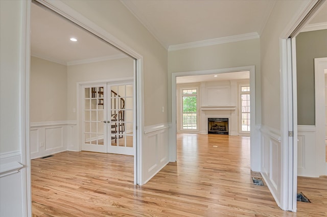 1 Bohler Ave, Evans, GA 30809 - hallway with a decorative wall, french doors, crown molding, light wood-type flooring, and wainscoting
