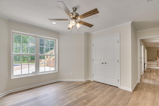 1 Bohler Ave, Evans, GA 30809 - unfurnished bedroom with light wood-style floors, crown molding, a closet, and ceiling fan