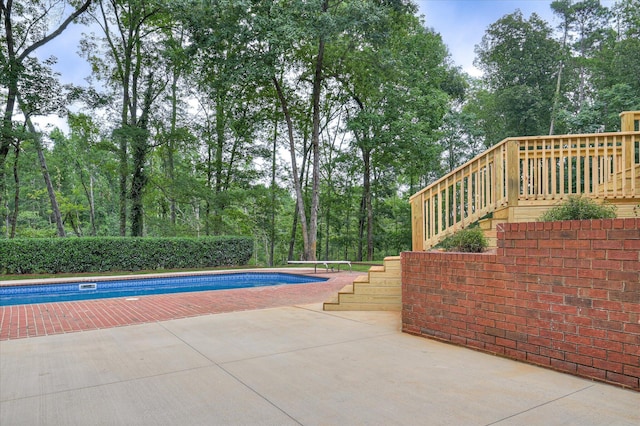 1 Bohler Ave, Evans, GA 30809 - view of pool with stairs, a patio area, a diving board, and view of wooded area