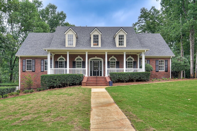 1 Bohler Ave, Evans, GA 30809 - new england style home featuring brick siding, covered porch, a front lawn, and roof with shingles