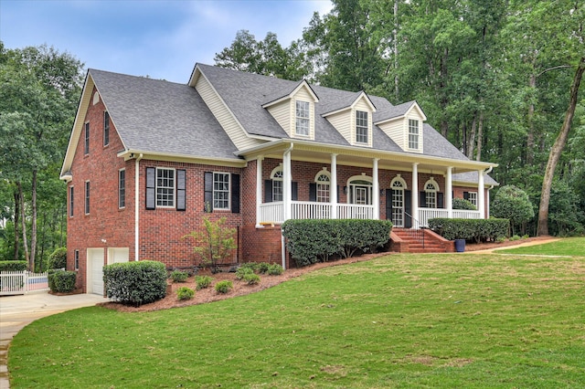 1 Bohler Ave, Evans, GA 30809 - cape cod house with brick siding, concrete driveway, a porch, a garage, and a front yard