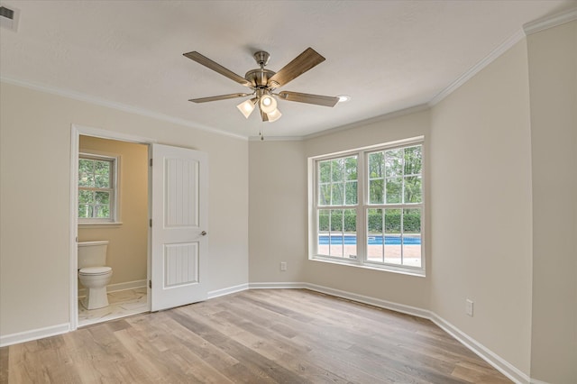 1 Bohler Ave, Evans, GA 30809 - unfurnished bedroom featuring light wood-style flooring, crown molding, ensuite bath, and a ceiling fan