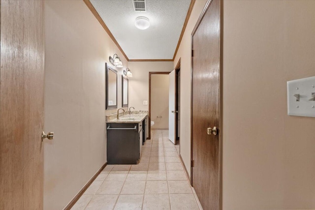 249 Usher Rd, Waynesboro, GA 30830 - hall with crown molding, a textured ceiling, and light tile patterned floors