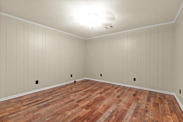249 Usher Rd, Waynesboro, GA 30830 - unfurnished room featuring wood finished floors, ornamental molding, and a textured ceiling