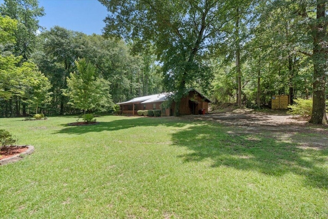 249 Usher Rd, Waynesboro, GA 30830 - view of green lawn featuring a pole building and an outbuilding