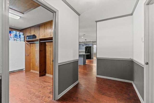 249 Usher Rd, Waynesboro, GA 30830 - hallway featuring wood finished floors, wood walls, and crown molding