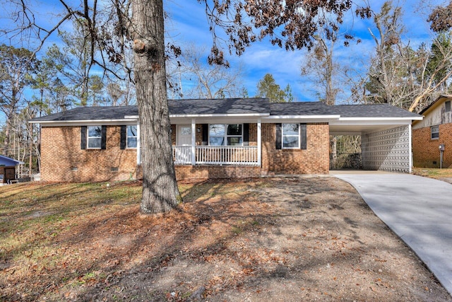 ranch-style home with a porch and a carport