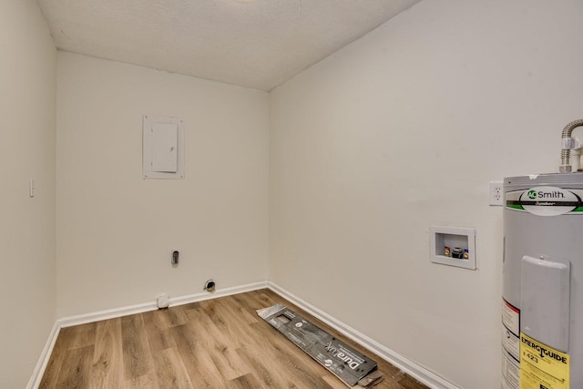 laundry room with hookup for a washing machine, electric water heater, light hardwood / wood-style floors, and a textured ceiling