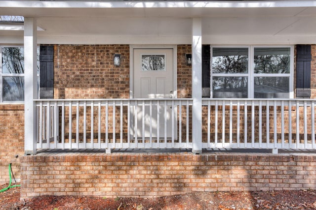 doorway to property featuring a porch