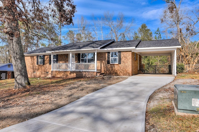 single story home with covered porch and a carport