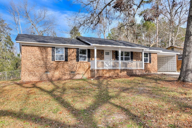 ranch-style house with covered porch and a front yard