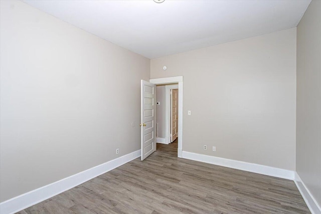 spare room with hardwood / wood-style flooring