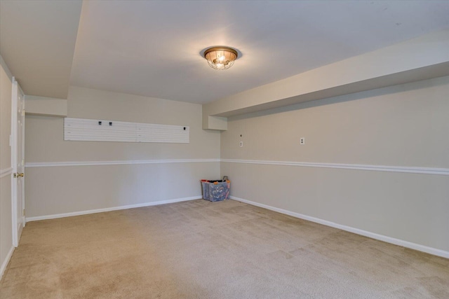 unfurnished room with carpet floors and baseboards