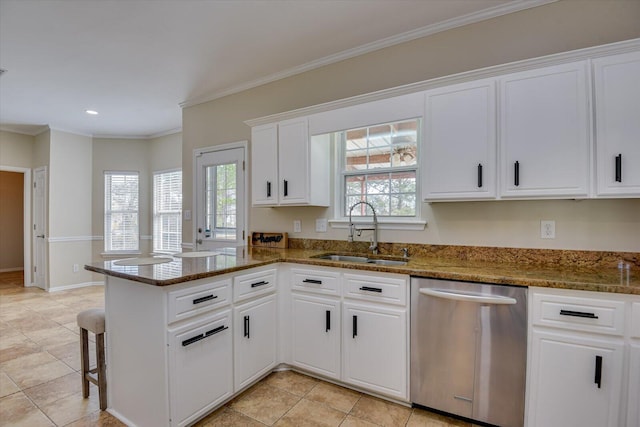 kitchen featuring a peninsula, a sink, white cabinetry, ornamental molding, and dishwasher