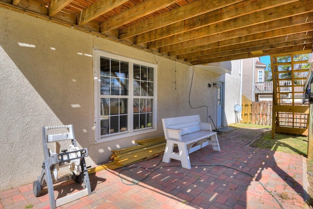 view of patio / terrace featuring fence