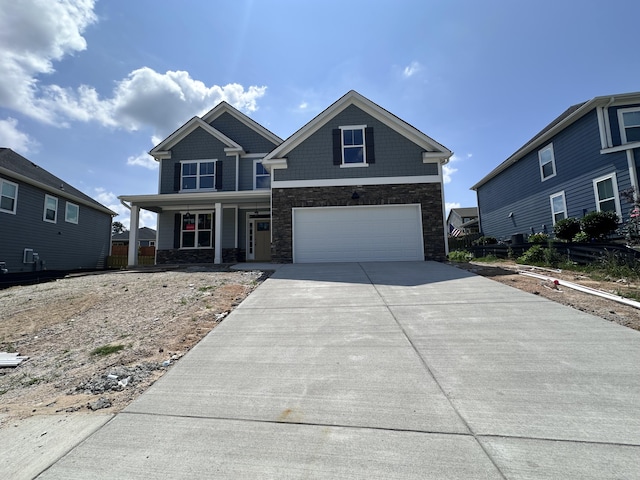 845 Lillian Park Dr, Grovetown, GA 30813 - craftsman-style home with stone siding, covered porch, a garage, and driveway