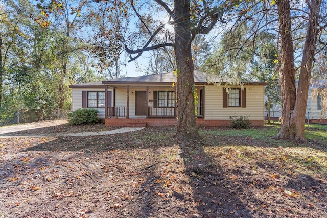 ranch-style house featuring covered porch