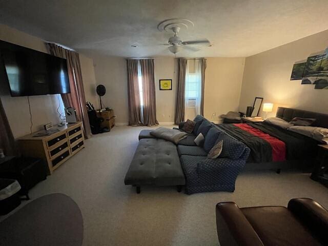 bedroom with ceiling fan and carpet flooring