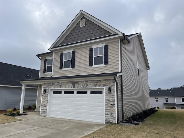 view of front of house with a garage and a front lawn